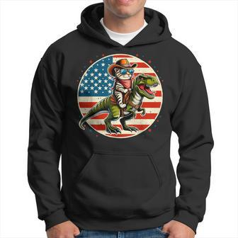Cowboy Cat Riding Dinosaur Usa Flag T-Rex 4Th Of July Hoodie - Monsterry