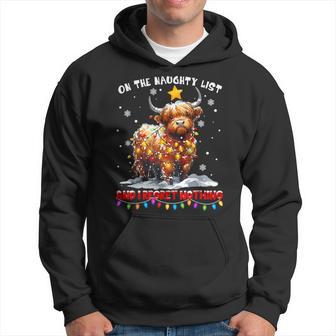 On The Naughty List And Reget Nothing Christmas Highland Cow Hoodie - Thegiftio UK