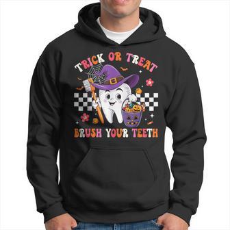 Trick Or Treat Brush Your Th Retro Halloween Cute Dentist Hoodie - Thegiftio UK