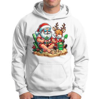 Santa And Friend At The Beach Christmas In July Summer Time Hoodie - Thegiftio UK