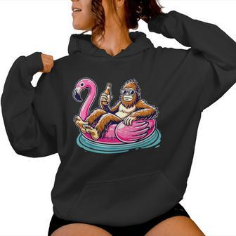 Bigfoot Chilling On Flamingo Float With Beer Fun Summer Vibe Women Hoodie - Monsterry