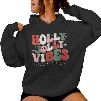 Groovy Holly Xmas Jolly Vibes Christmas Lights Santa Hat Women Hoodie - Thegiftio UK