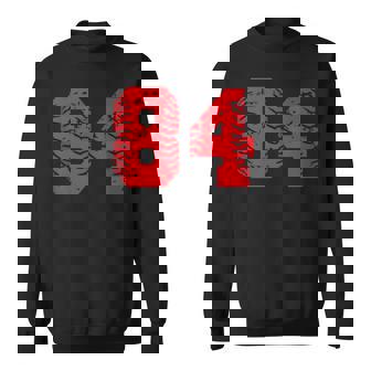 Baseball Softball Player Number 84 Red Grunge Lucky Number Sweatshirt - Monsterry
