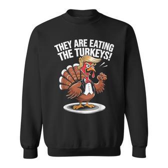 They Are Eating The Turkeys Thanksgiving Turkey Trump Sweatshirt - Thegiftio UK