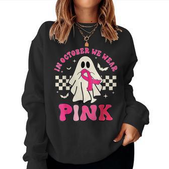In October We Wear Pink Breast Cancer Groovy Ghost Halloween Women Sweatshirt - Thegiftio UK