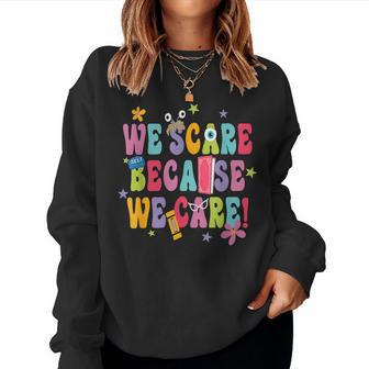 We Scare Groovy Because We Care For Halloween Women Sweatshirt - Thegiftio UK