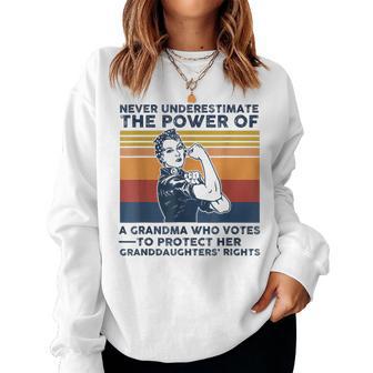 Never Underestimate The Power Of A Grandma Who Votes Women Sweatshirt - Thegiftio UK