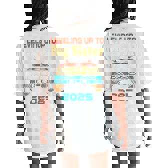 Retro Leveling Up To Big Sister 2025 Baby Announcement Women's Oversized Comfort T-Shirt Back Print | Seseable UK