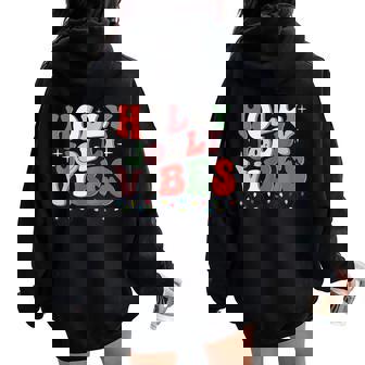 Groovy Holly Xmas Jolly Vibes Christmas Lights Santa Hat Women Oversized Hoodie Back Print - Thegiftio