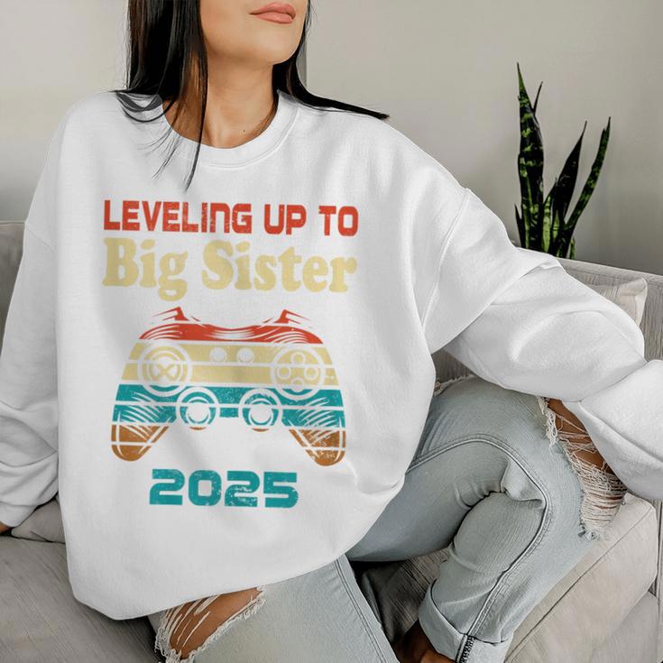 Retro Leveling Up To Big Sister 2025 Baby Announcement Women Sweatshirt Gifts for Her