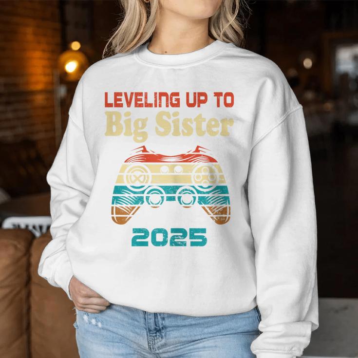 Retro Leveling Up To Big Sister 2025 Baby Announcement Women Sweatshirt Funny Gifts
