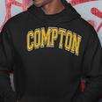 Compton Arched Amber Text Felpa con cappuccio Regalos divertidos
