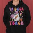 Trick Or Teach Groovy Halloween Floral Ghost Teacher Women Hoodie