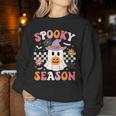 Spooky Season Ghost Holding Pumpkin Groovy Halloween Ghost Women Sweatshirt Personalized Gifts